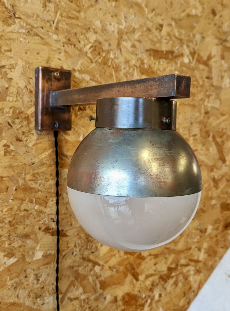 Brass and glass “Helioray” wall sconce