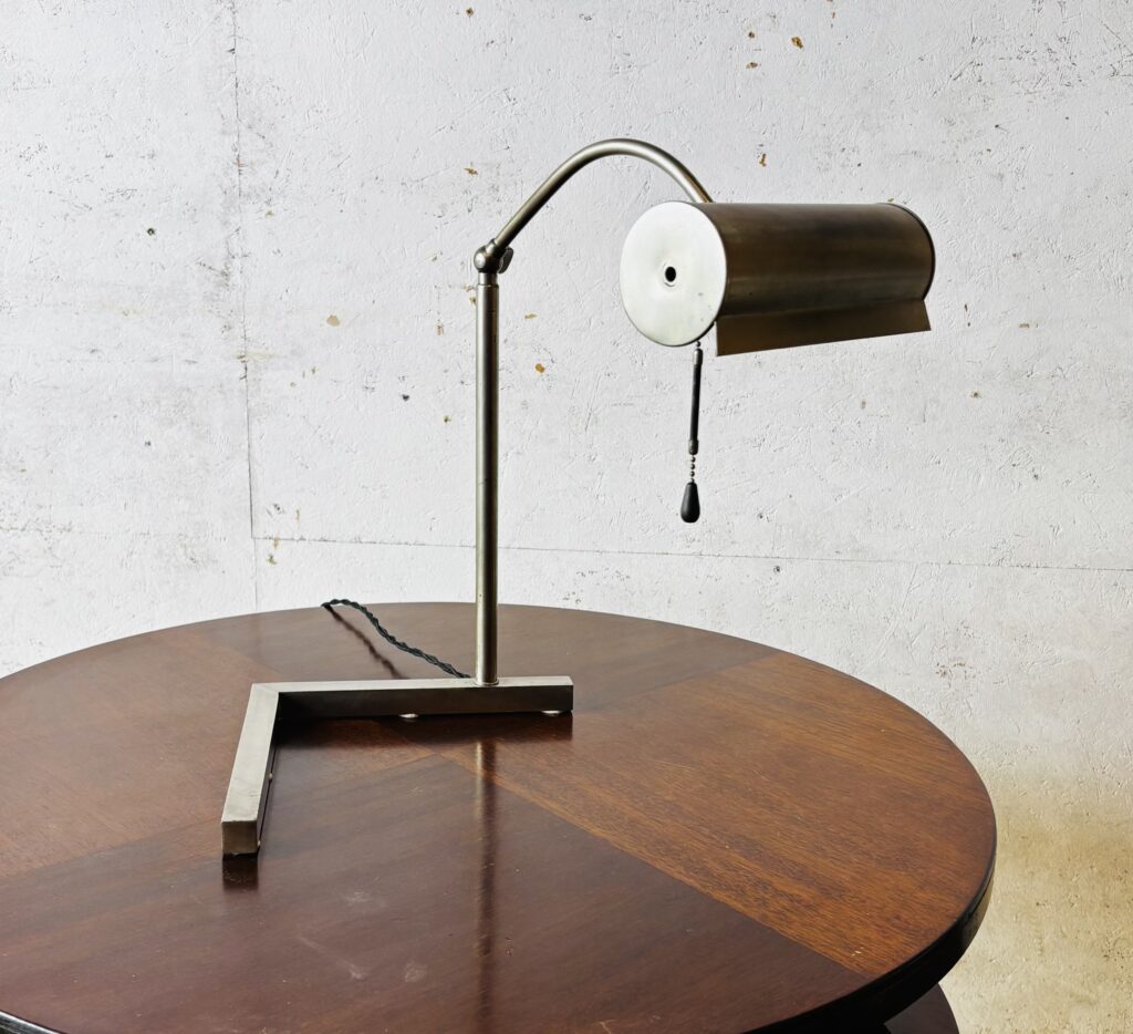 Modernist table lamp or desk light with adjustable height and shade,